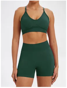 Close-up detail of a dark green seamless yoga bra and shorts set for women