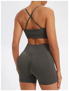 Back view detail of seamless dark grey yoga set featuring a crisscross sports bra and shorts