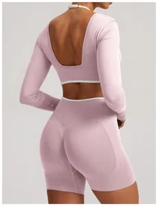 Detail of seamless long sleeve yoga top and high waist shorts in dusty pink color