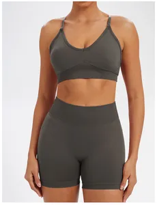 Close-up of seamless dark grey yoga set featuring high-waist shorts and sports bra