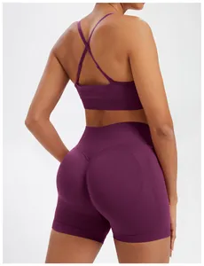Detailed back view of a seamless purple yoga set featuring a cross-back sports bra