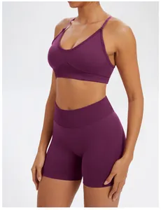 Detailed side view of seamless purple yoga bra and high-waisted shorts on model
