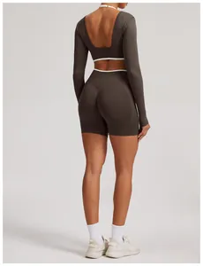 Back view of seamless dark gray yoga set with long sleeve top and shorts.