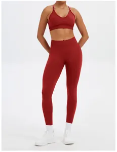 Two-piece red seamless yoga set featuring a supportive sports bra and high-waist leggings