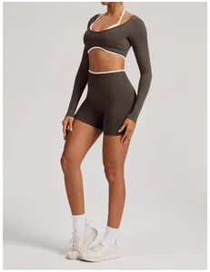 Detailed side view of seamless yoga set featuring long sleeve crop top and matching shorts