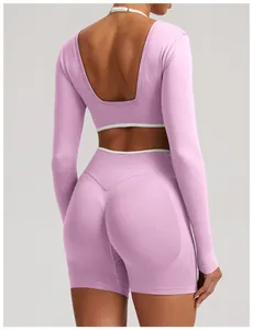 Close-up detail of a pink seamless long sleeve yoga set featuring an open back design