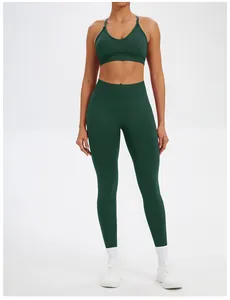 Front view of dark green seamless yoga set including sports bra and high waist leggings