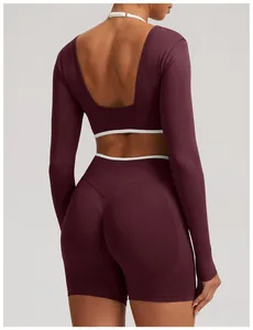 Back view detail of seamless long-sleeve yoga set in burgundy with backless design