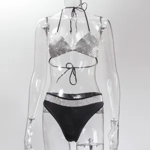 Detail view of a black bikini set with sparkling silver rhinestone embellishments