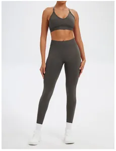 Front view of women's seamless grey yoga set with sports bra and high-waisted leggings
