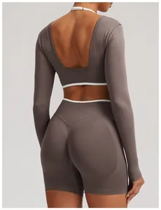 Back view of a seamless brown long-sleeve workout set with elegant open back design