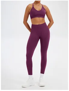 Detail of a purple seamless yoga set including a V-neck sports bra and high-waisted leggings