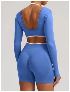 Detail view of seamless blue yoga set featuring a deep U-shaped back and knit texture.