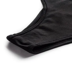 Detailed macro close-up view showing the black bikini bottom stitching and texture.