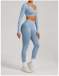 Detail view of a seamless long-sleeve blue yoga set with high-waist leggings for women.