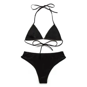 Flat lay view of a chic black halter triangle bikini set with thin tie straps and low-rise bottom