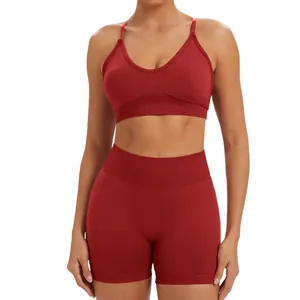 Two-piece seamless wine red yoga set featuring V-neck sports bra and high-waisted shorts