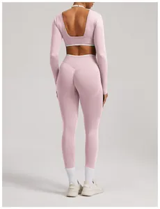 Back view of a pink seamless long-sleeve yoga set showing open back detail and fit.