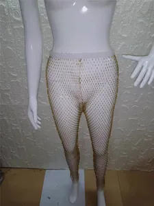 Leggings de rejilla con pedrería dorada para mujer, pantalones de escenario brillantes.