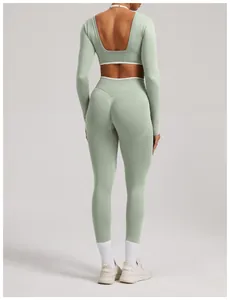 Back view of sage green seamless long-sleeve yoga set with backless top and leggings