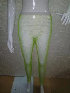 Leggings de malla verde neón con pedrería para actuaciones y fiestas nocturnas.