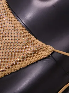 Vue détaillée d'un bikini sexy en maille beige orné de strass AB irisés et scintillants.