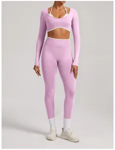 Detail shot of a pink long-sleeved seamless yoga set with white trim for women fitness