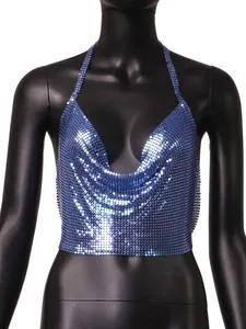 Macro view of the shiny blue metallic sequin texture on a sexy women's halter neck top