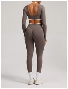 Back view of a seamless yoga set with long-sleeved open back top and high-waisted leggings