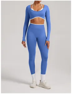 High-waist seamless blue yoga set with long-sleeved top and white contrast trim details