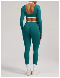 Back view of teal seamless long sleeve yoga top and high waist leggings fitness set