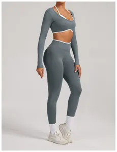 Professional studio detail of seamless long sleeve yoga set with leggings in slate gray