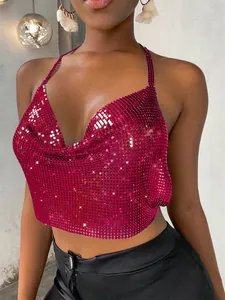 Detailed view of a sexy magenta metallic sequined halter crop top with draped neckline.