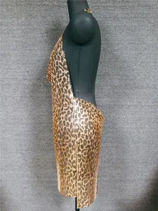 Side view of a sexy leopard print metallic sequin backless dress for nightclub wear