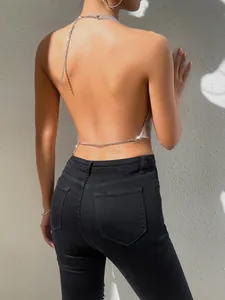 Close-up of sexy silver metal sequin halter backless top for glamorous nightclub wear