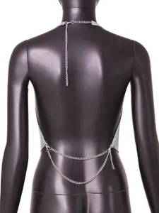 Detailed back view of a sexy silver metallic sequin backless halter top with chains.