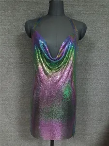 Detailed view of iridescent metallic sequin mesh fabric on a sexy halter neck dress