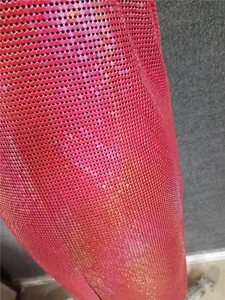 Close-up detail of pink metallic sequin mesh fabric for sexy nightclub dress