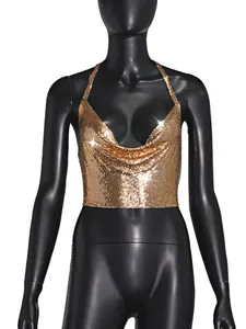 Detail of a shimmering gold metallic sequin halter neck top displayed on a mannequin
