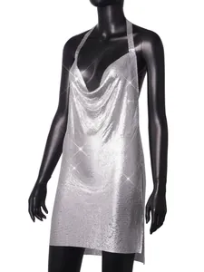 Detail view of a shimmering silver metallic mesh halter dress on a black mannequin