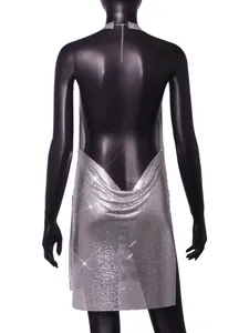 Back view of silver metal sequin halter mini dress showing draped backless detail.