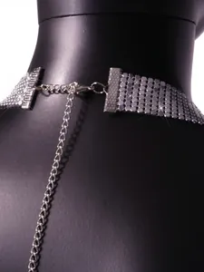 Close-up detail of the back closure on a sexy silver metallic sequin party dress