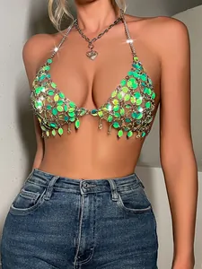 Exquisite close-up of handcrafted iridescent leaf-shaped sequins on a sexy nightclub halter top