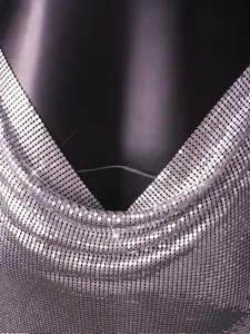Close-up view showing the textured neckline of a sexy silver metallic sequin mesh dress