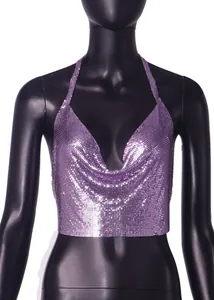 Macro detail showing shimmering purple metallic sequin mesh on a sexy halter backless top