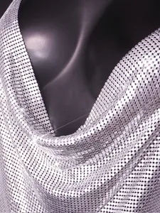 Close-up of silver metallic mesh sequin dress showing detailed reflective texture