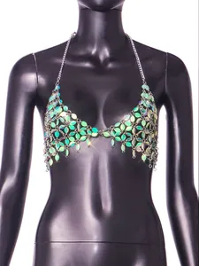Close-up of a handmade iridescent leaf sequin halter top displayed on a mannequin.