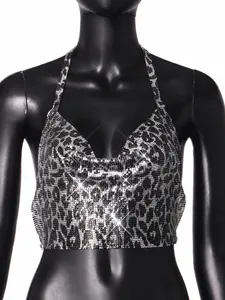Close-up of metal sequin halter top with sparkling silver and black leopard print mesh