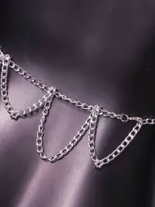 Detailed close-up of handmade silver chain halter top showing high-shine link texture
