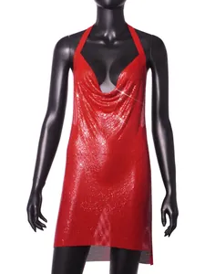 Close-up of a glamorous red metallic sequin halter dress with shimmering mesh texture